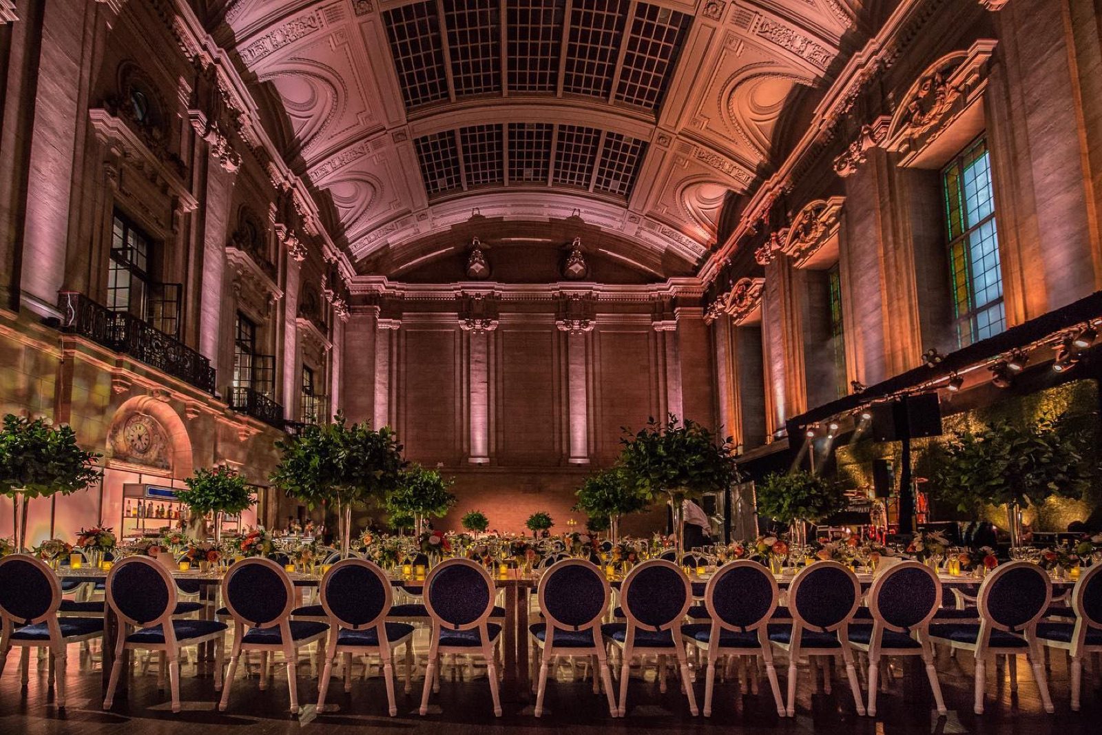A historic hall set for a seated dinner