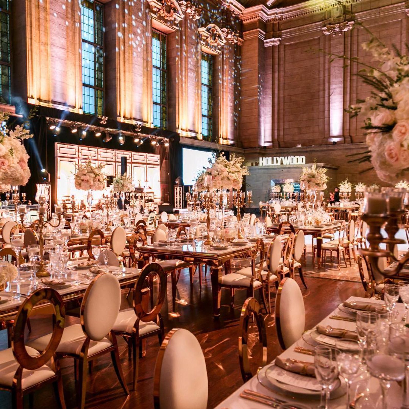 Warm golden light over a full dining hall